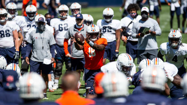 Auburn quarterback Dematrius Davis (18) snaps the ball during an open football practice at Jordan-Hare Stadium in Auburn, Ala., on Saturday, March 20, 2021.